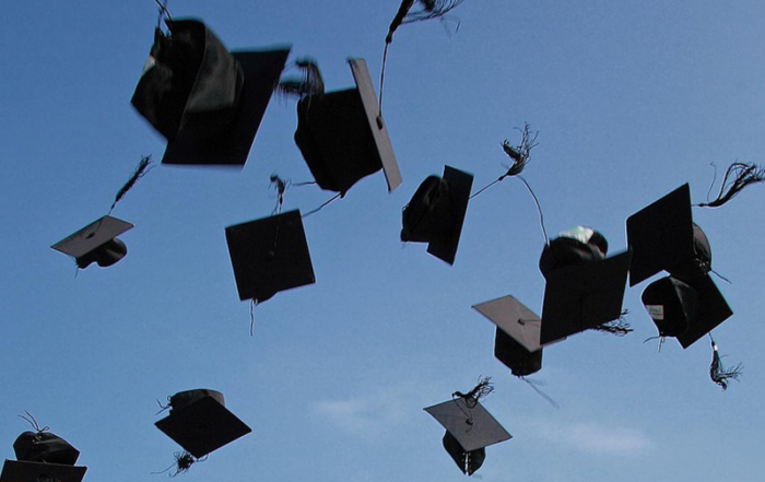 Graduation caps tossed up into the sky